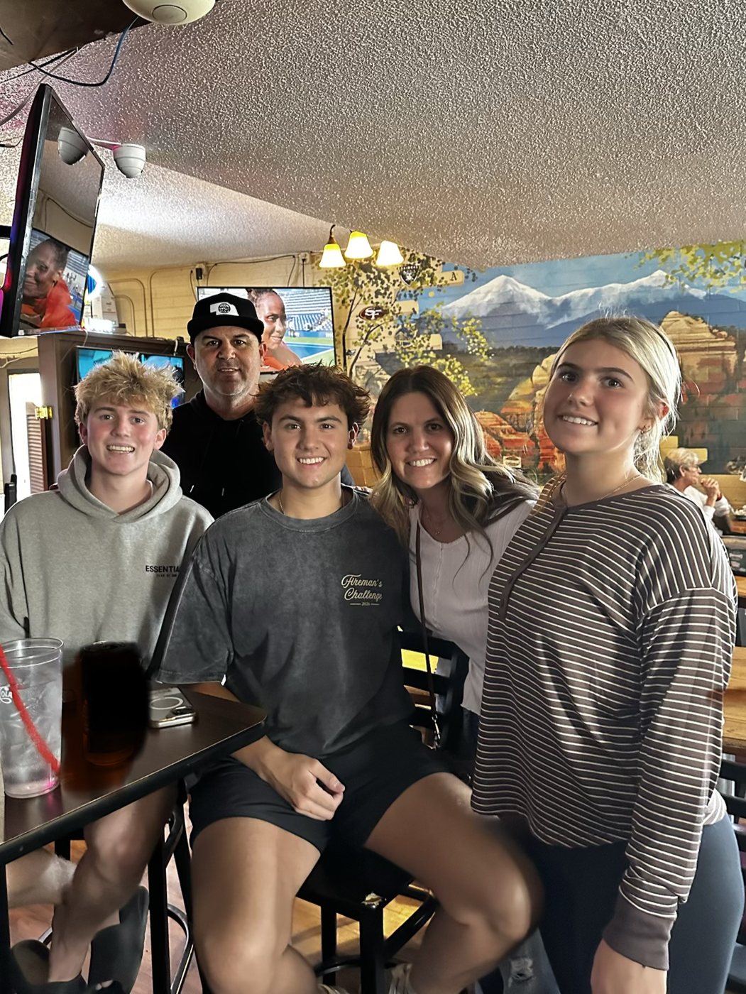 Brian, Tara, Maddox, Kendrix and Jax Snyder together at a restaurant