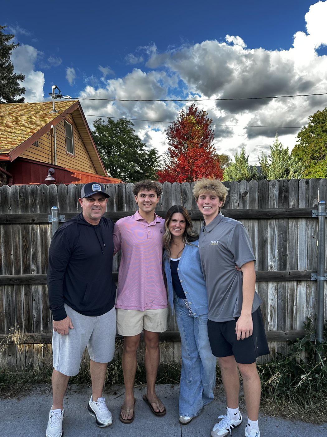 Jax with his dad Brian, mom Tara and brother Maddox outside in Flagstaff