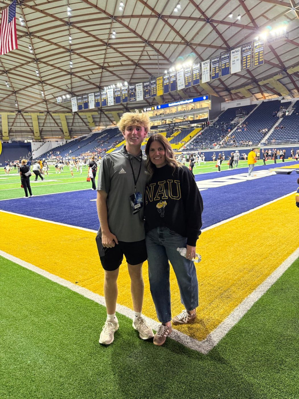 Jax with his mom inside the Walkup Skydome at NAU