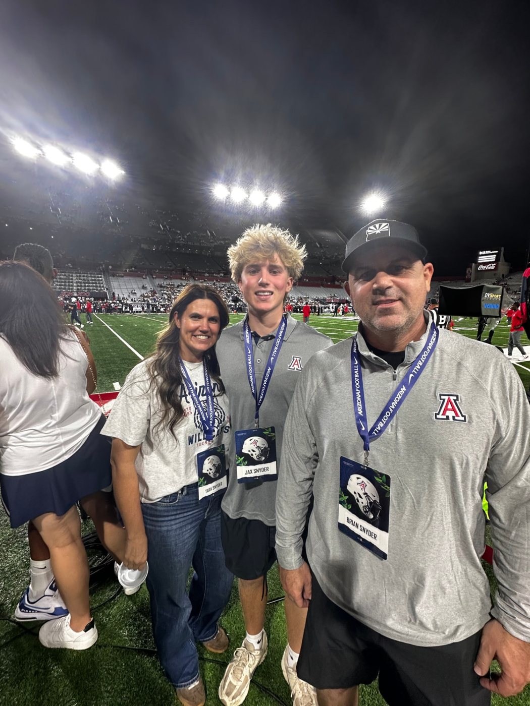 Jax with his parents at a University of Arizona game